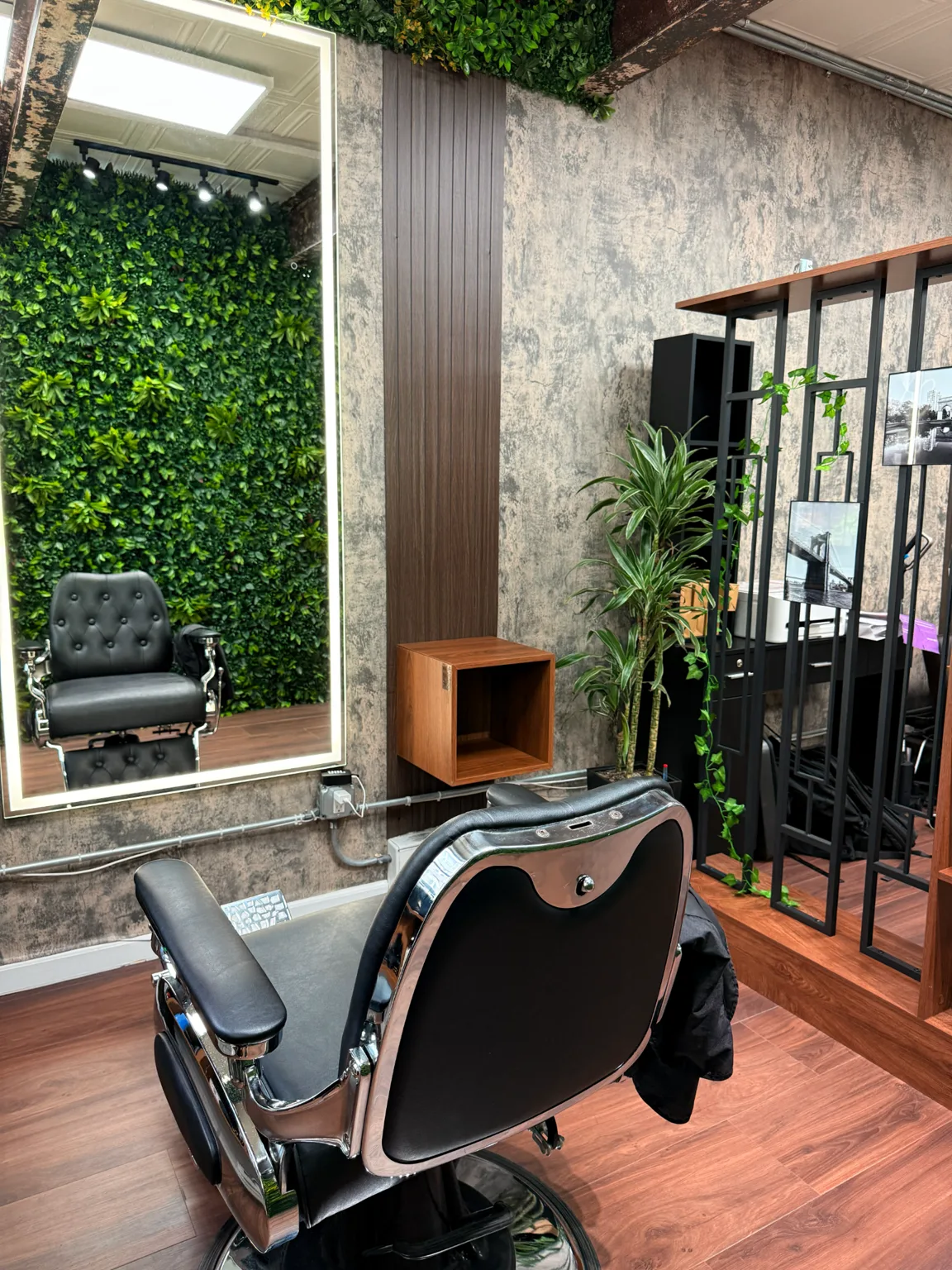 Private Meshkov Barber studio with barber chair and green wall in Manhattan